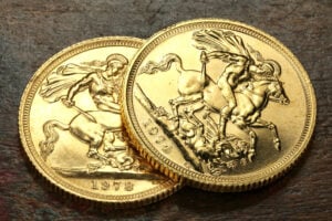 British,Sovereign,Gold,Coins,On,Rustic,Wooden,Background