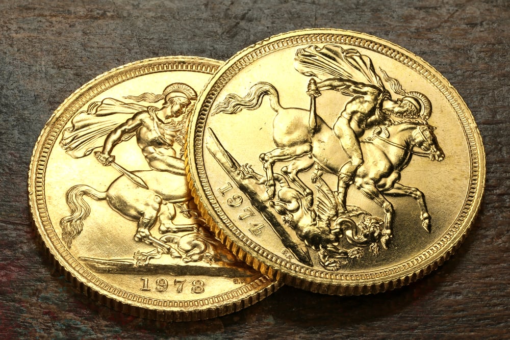 British,Sovereign,Gold,Coins,On,Rustic,Wooden,Background